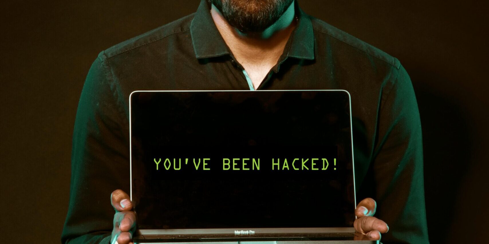 9-Signs-That-Your-Smart-Home-Device-Has-Been-Hacked-scaled.jpg Free Man Holding Laptop Computer With Both Hands Stock Photo