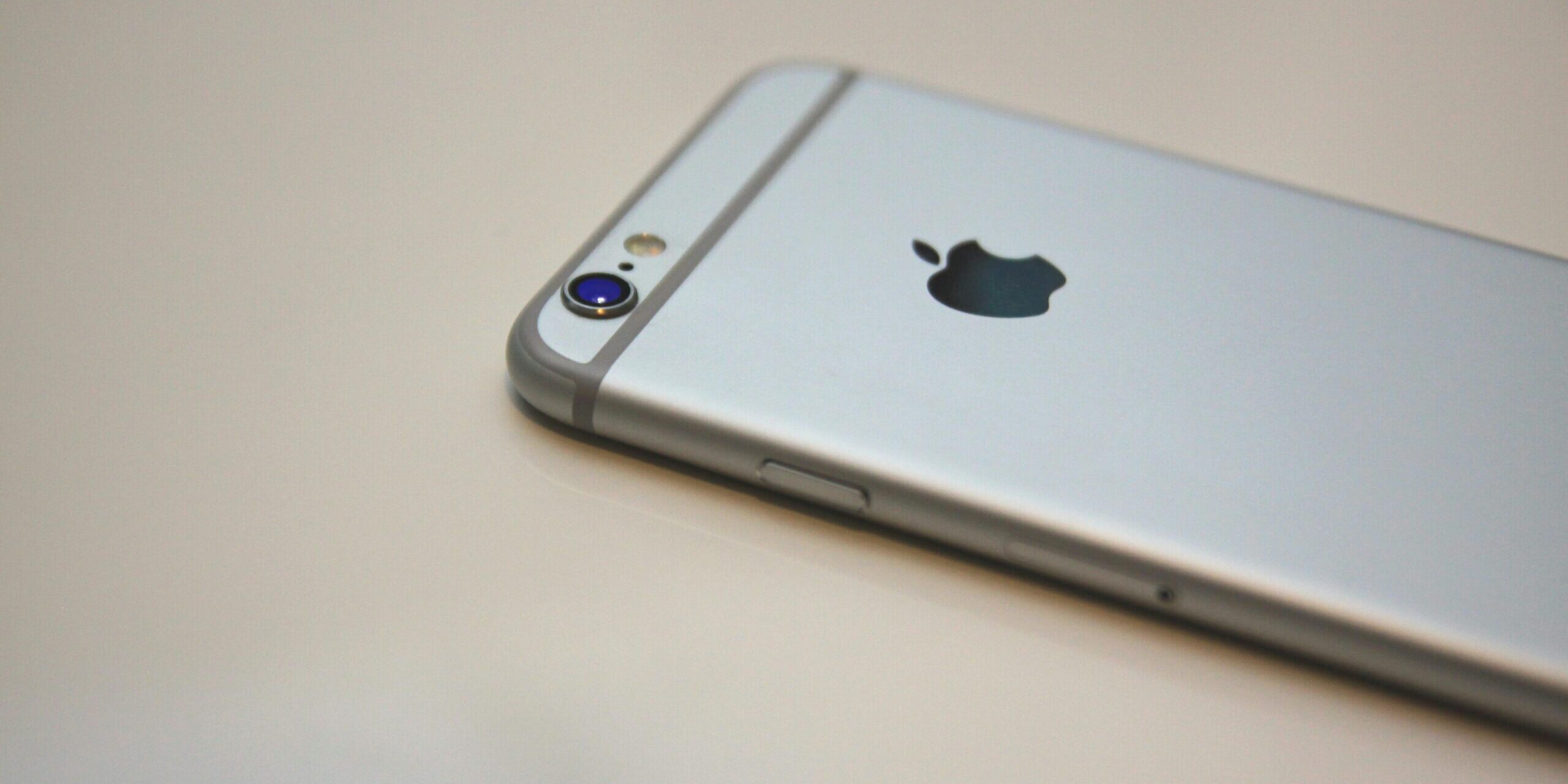 iPhone-Running-Slow-Speed-It-up-with-One-of-These-Tips-scaled.jpg Free Space Gray iPhone 6 Stock Photo