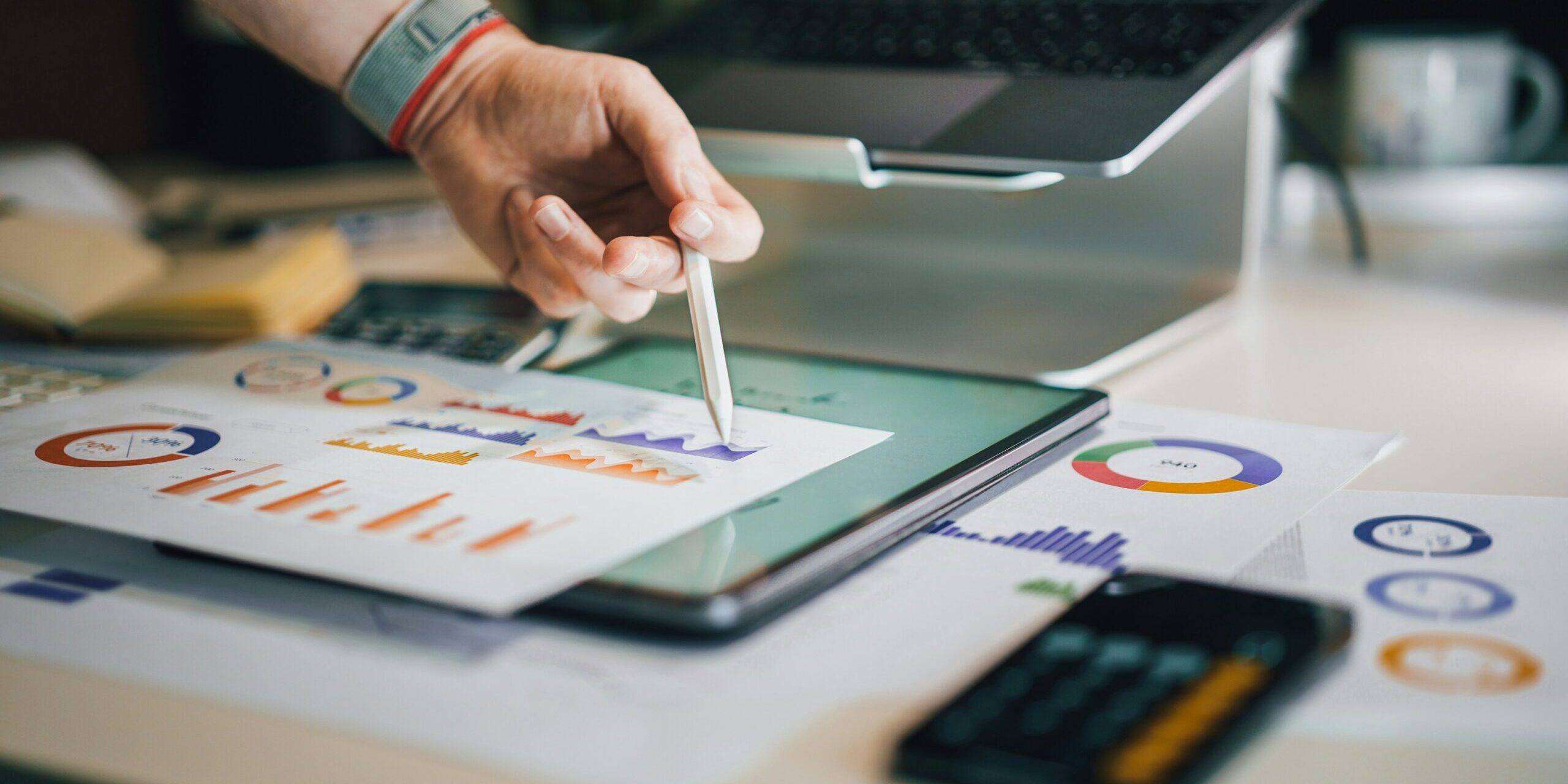 jakub-zerdzicki-ykgLX_CwtDw-unsplash-scaled.jpg a person is writing on a piece of paper