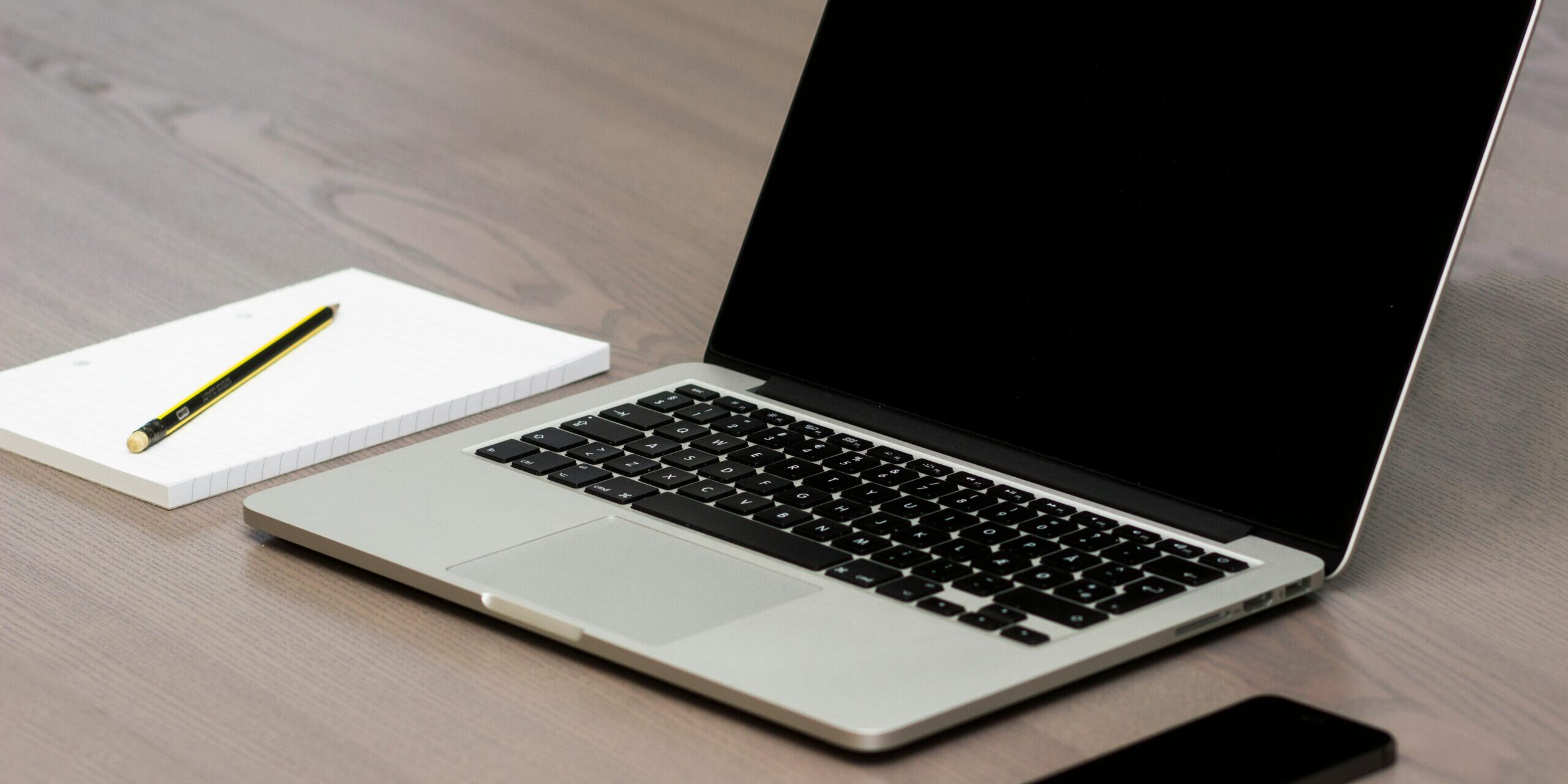 pexels-morningtrain-18104-scaled.jpg Free Silver Macbook Beside Iphone Stock Photo