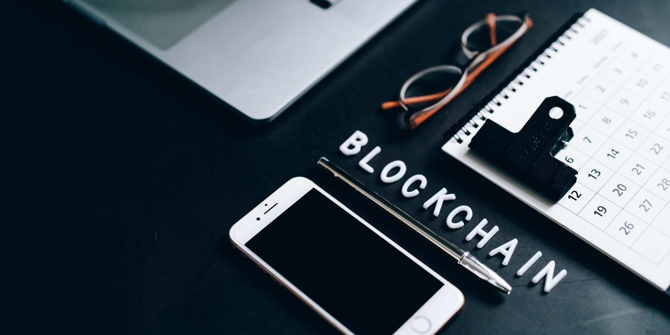 What-is-Blockchain-Technology-and-How-Does-it-Work_-scaled.jpg Free Flat lay of a modern digital workspace with blockchain theme, featuring a smartphone and calendar. Stock Photo