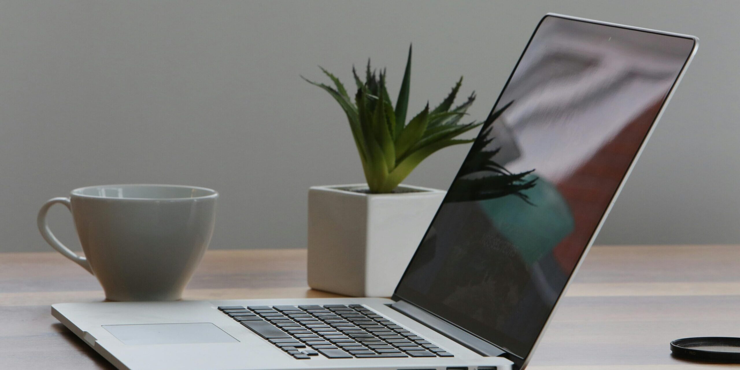 7-Ways-Using-AI-for-Work-Can-Get-Complicated-scaled.jpg Free Minimalist home office desk with laptop, smartphone, and plant for a modern work environment. Stock Photo