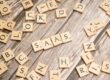scrabble-letters-spelling-saas-on-a-wooden-tabl